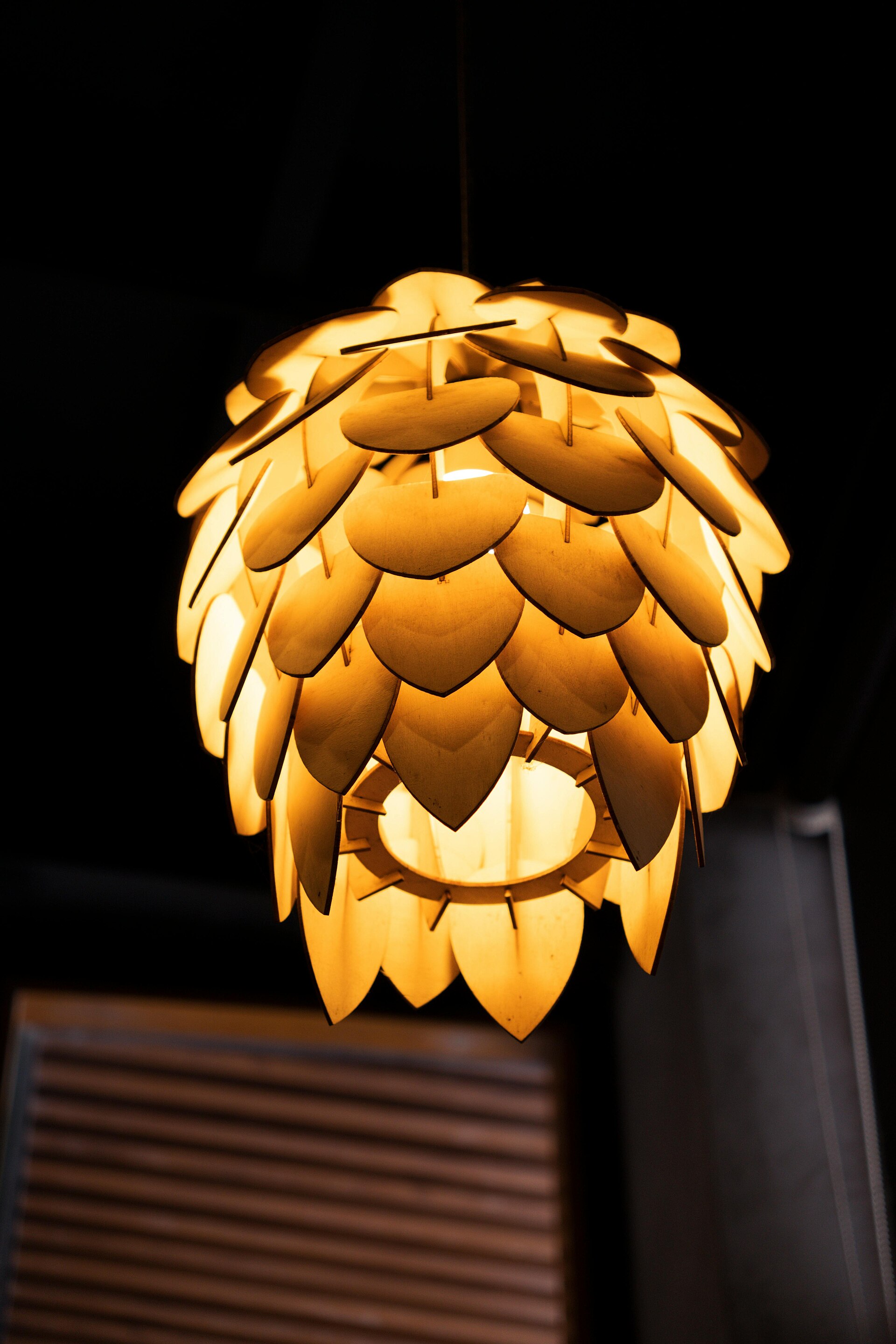 Before: warm pendant lamp in a dark room